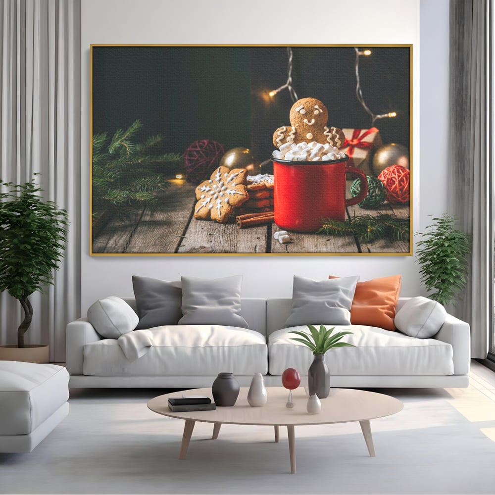 Tablou canvas cu tablou canvas cu turta dulce si cana rosie, in rama de aluminiu auriu, pe perete intr-un living